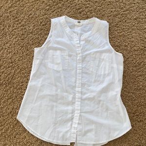 White sleeveless button up.